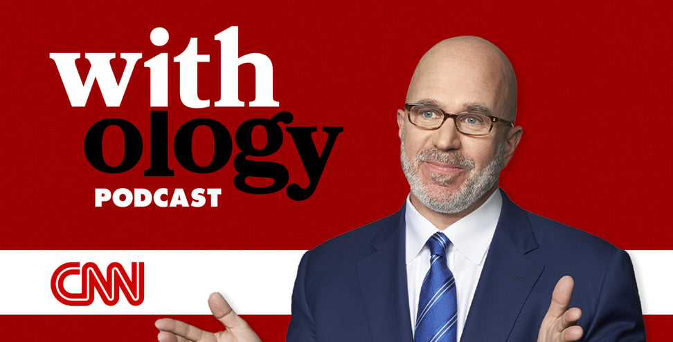 American radio host and television presenter, Micheal Smerconish poses for headshot in front of a red background. Behind him the text reads "Withology podcast'.