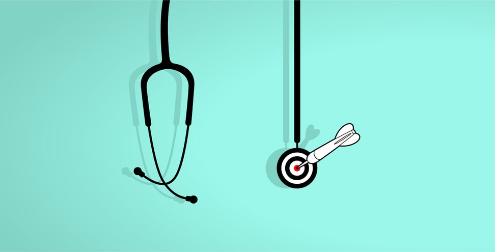 On top of a light blue background is a stethoscope graphic. The chest piece of the stethoscope is dart board with a dart hitting the red bullseye. 