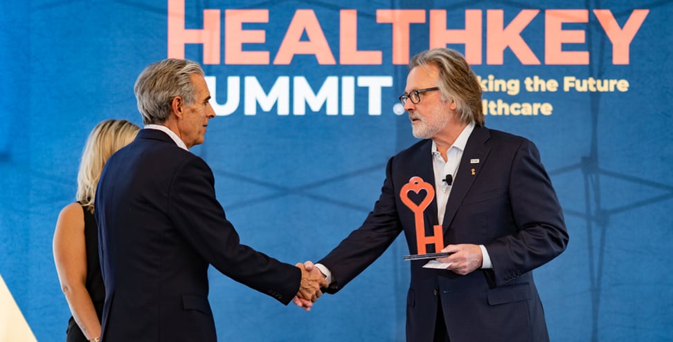 Brian Tierney, CEO, Brian Communications delivering HealthKey Heroes Award to Dr. Louis Levitt, Chief Medical Officer, MedVanta