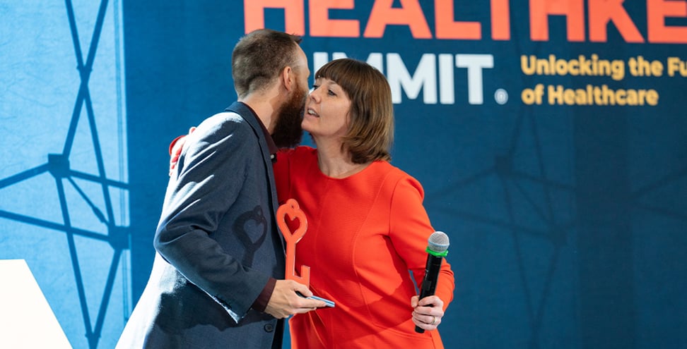 Heather Falck Major, Executive Director, Independence Blue Cross Foundation delivering HealthKey Heroes Award to Shane Janick, MPH, Executive Director, The Arc of Philadelphia