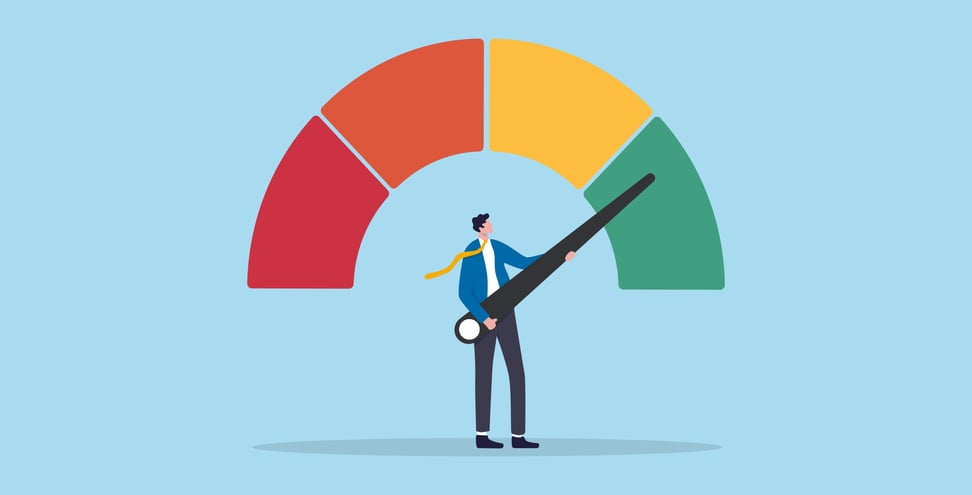 Businessman holding performance improvement or risk gauge indicator.