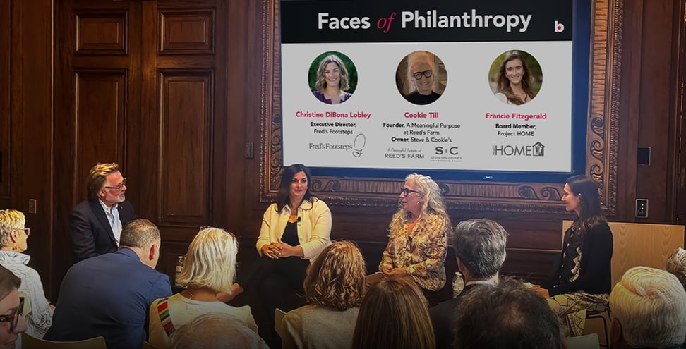 Panel of 3 women and moderator to the left in boardroom 'Faces of Philanthropy'
