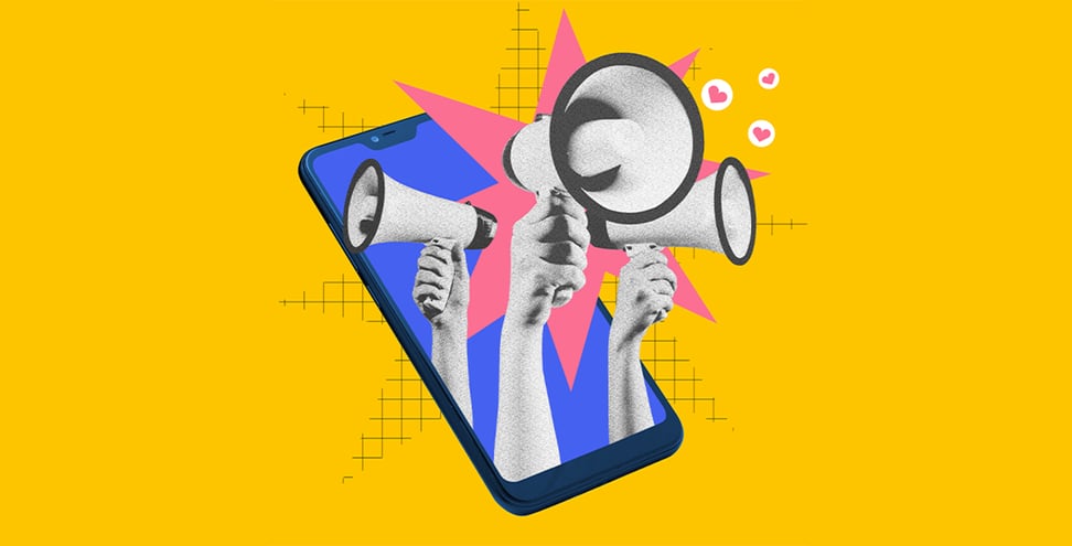 Hands with three megaphones stacking out phone screen symbolizing importance and relevance of usage social media for bran promotion